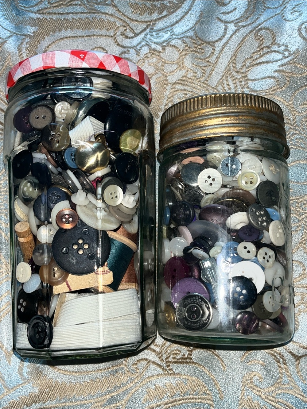 2 Jars of buttons and sewing accessories. Great for crafts or repairs